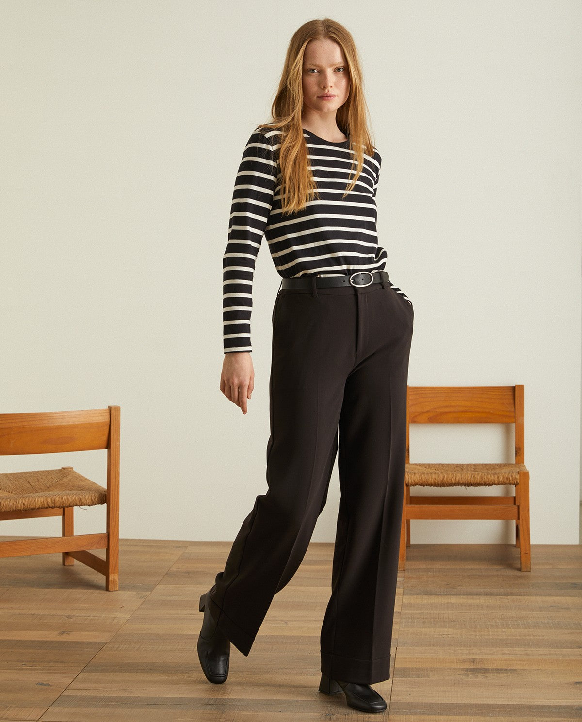 Flared wide ankle trousers in black by YERSE