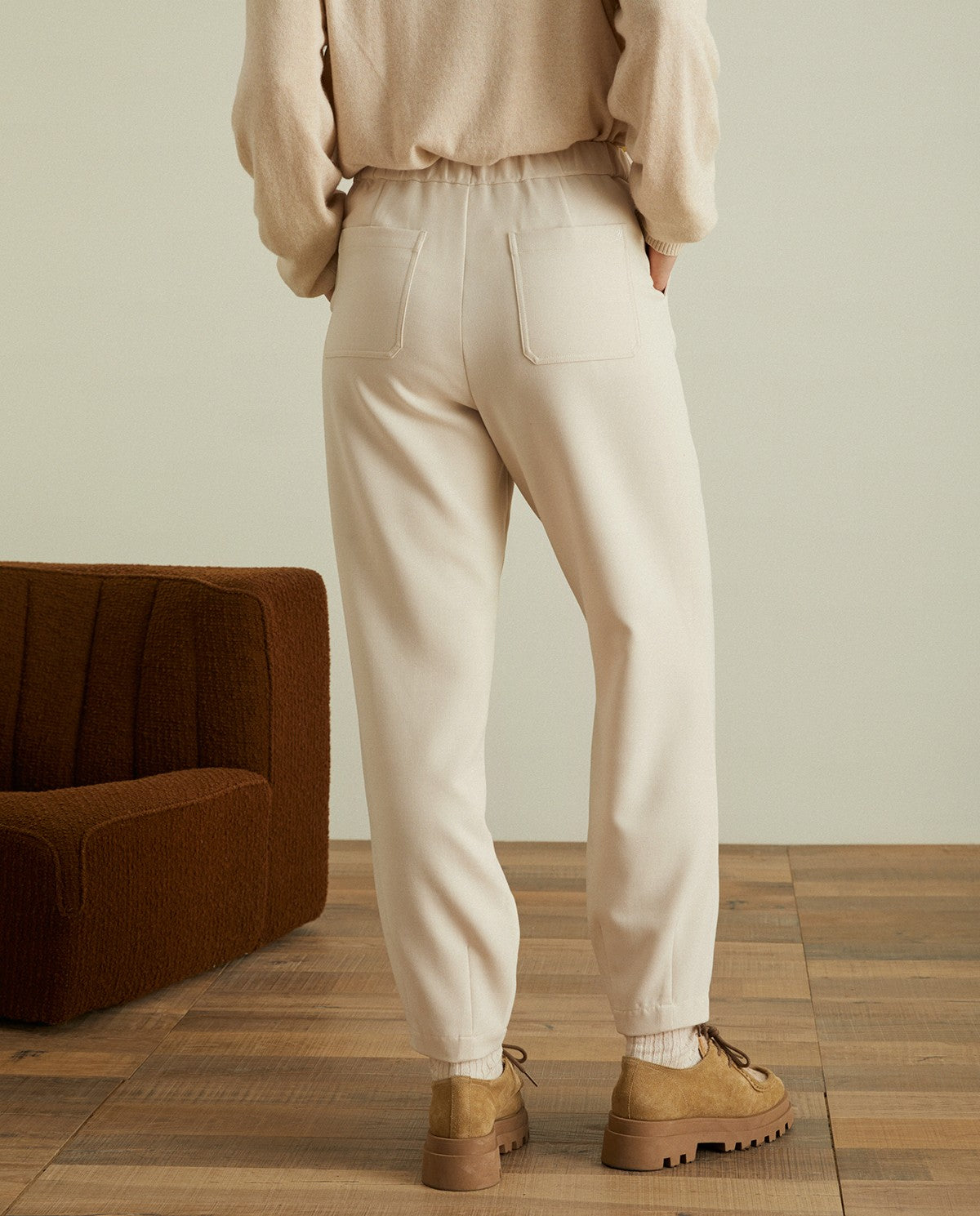 Pleated ankle trousers in ecru by YERSE