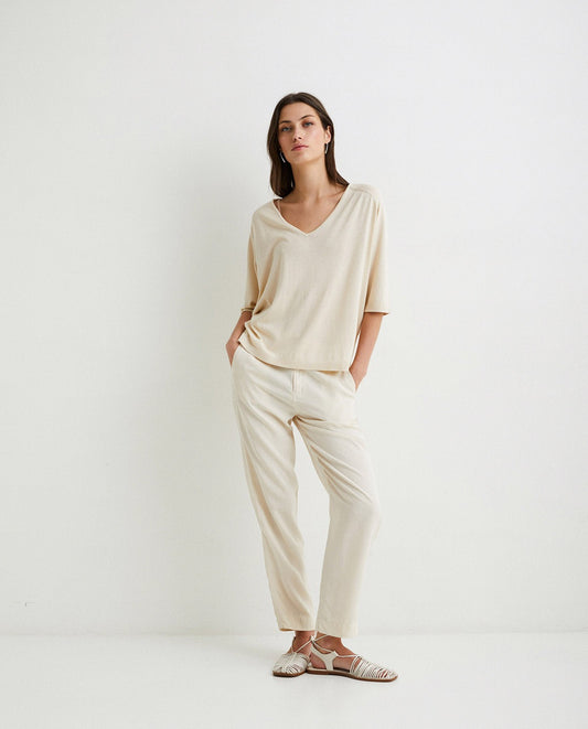 Flowy tencel trousers in ivory by YERSE