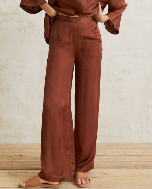 Flowy sateen chocolate trousers by YERSE