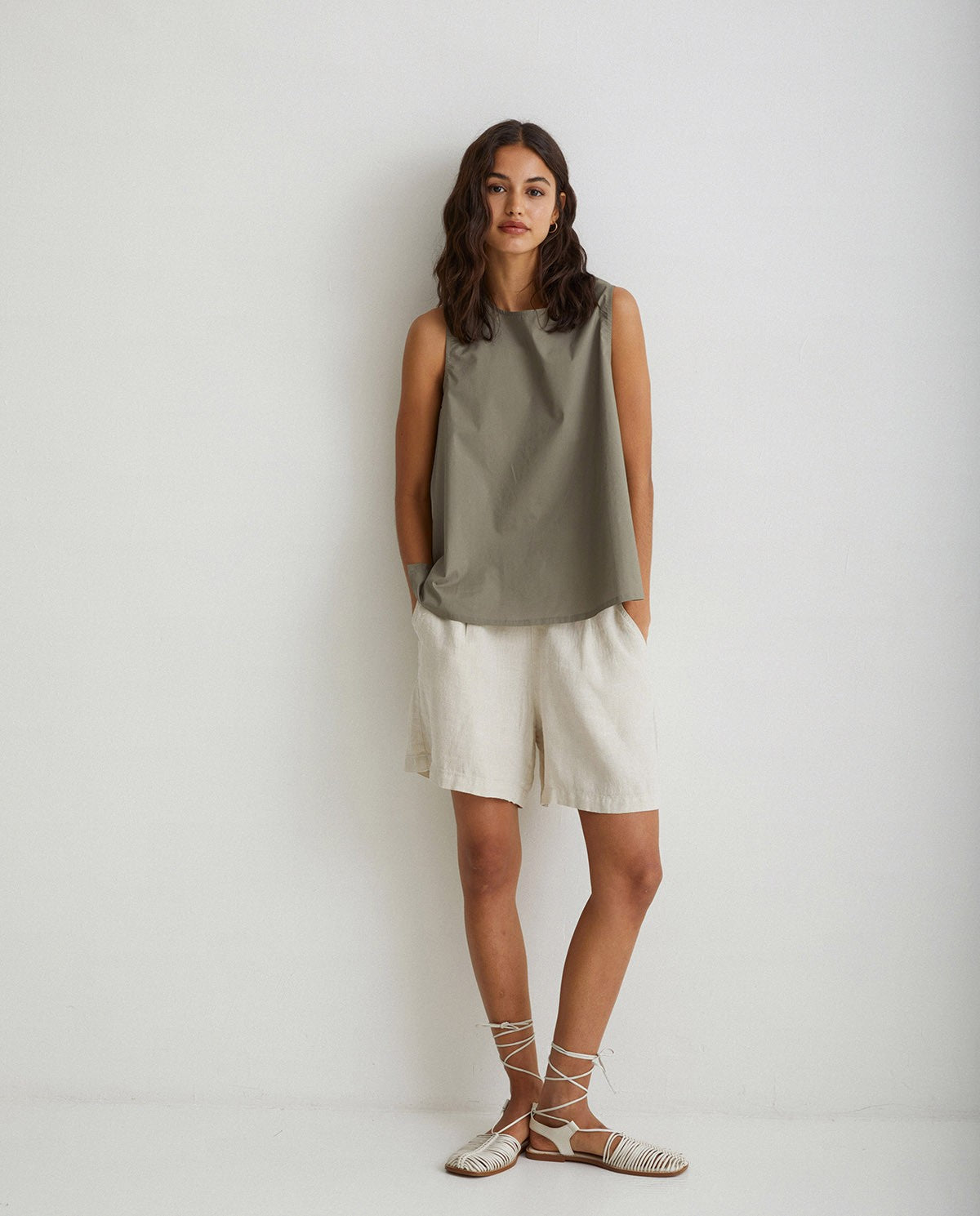 Linen pleated shorts in ivory by YERSE