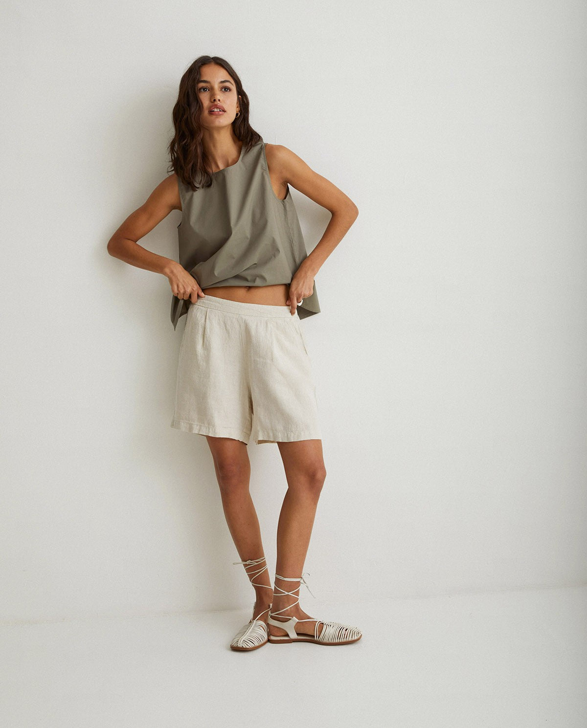 Linen pleated shorts in ivory by YERSE