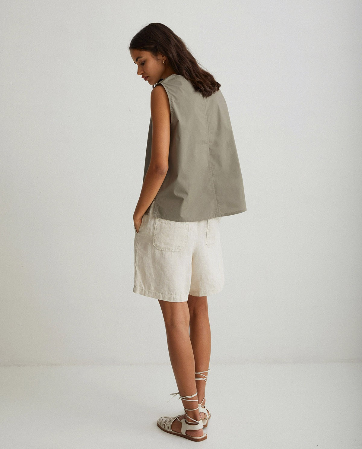 Linen pleated shorts in ivory by YERSE