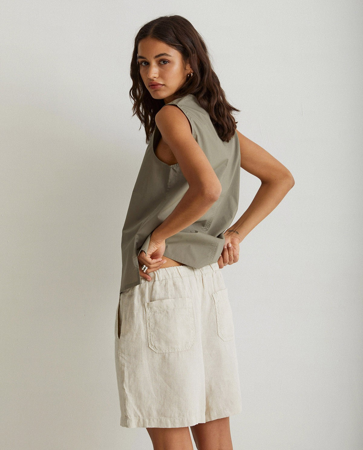 Linen pleated shorts in ivory by YERSE