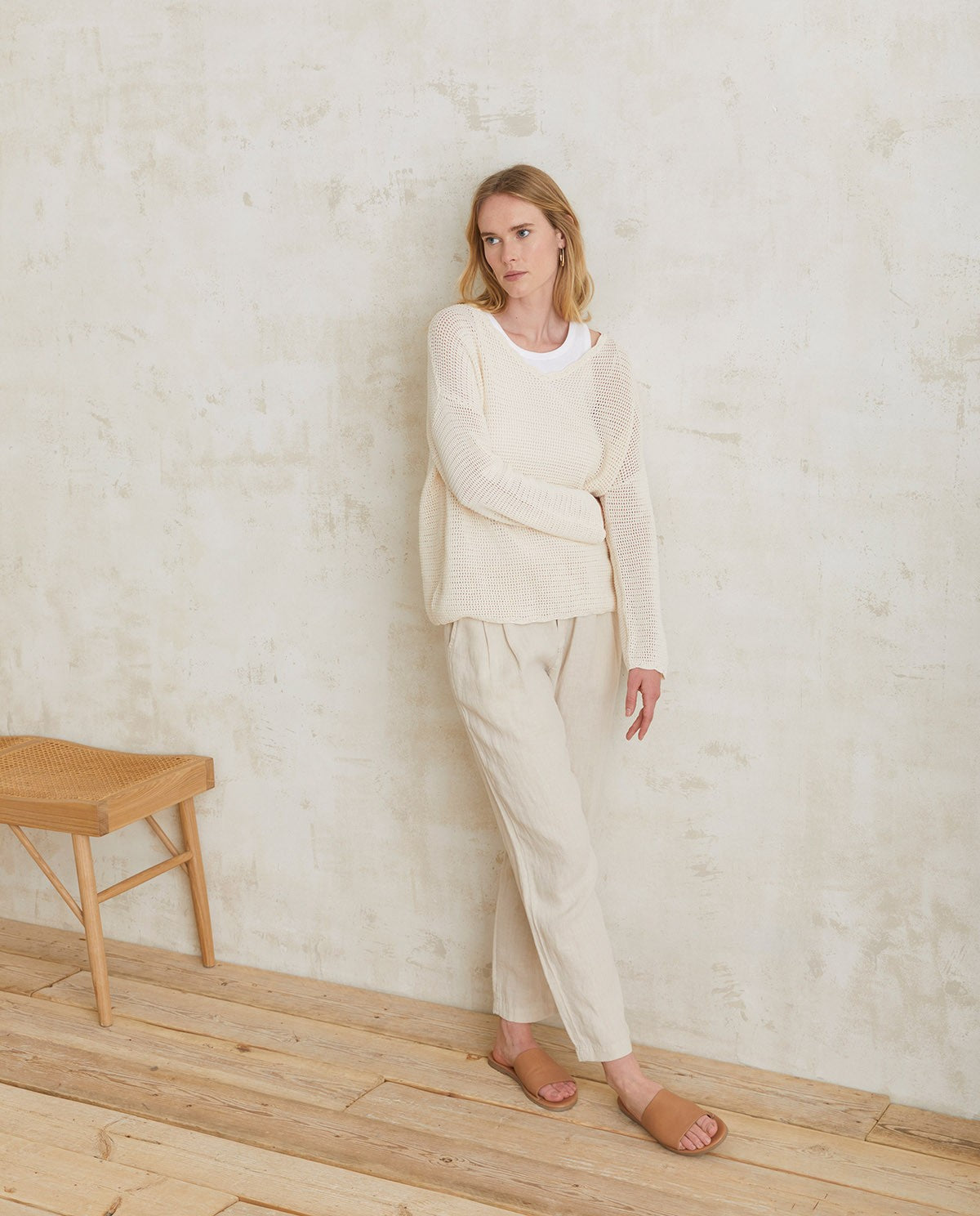 Linen pleated trousers in ivory by YERSE