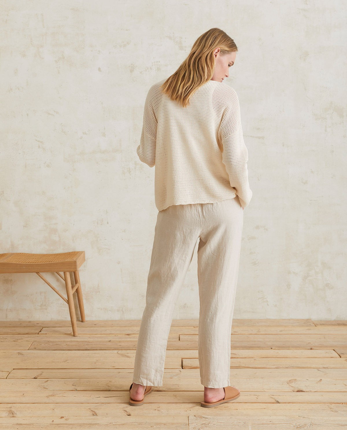 Linen pleated trousers in ivory by YERSE