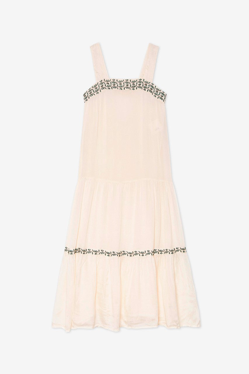 Long white dress with petite-embroidered details by NKN