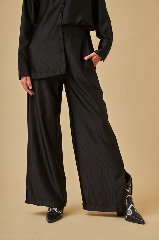 Flowy black satin palazzo trousers by NKN