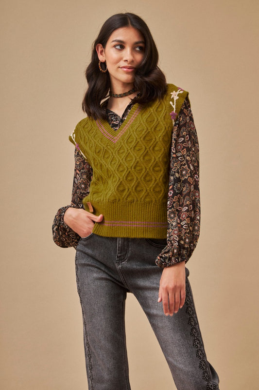 Green knit vest with embroidered floral armholes by NKN