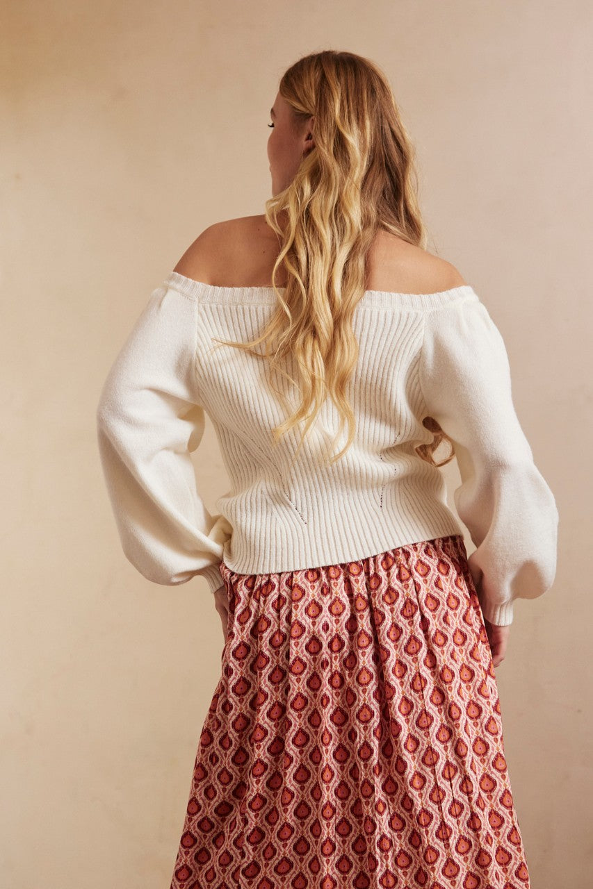 Off-shoulder sweater in cream by NKN